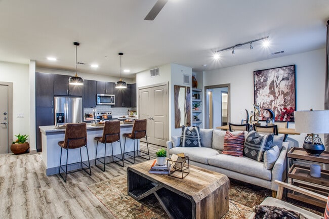 Kitchen, living, and dining area with hard surface flooring - Avalon Benbrook