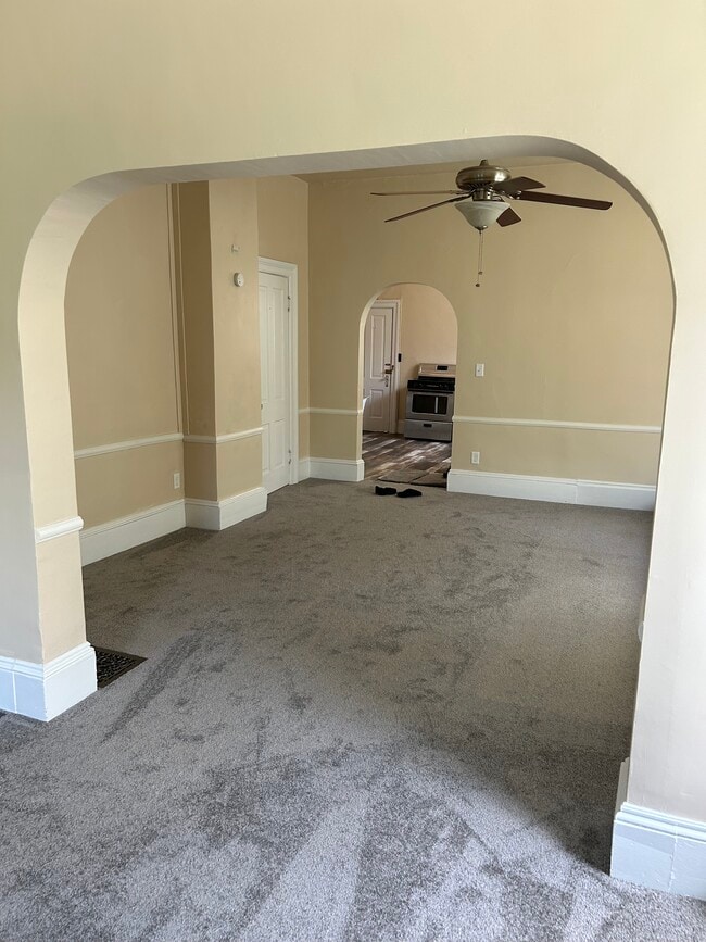 From living room into dining room room and kitchen area - 828 N 3rd St