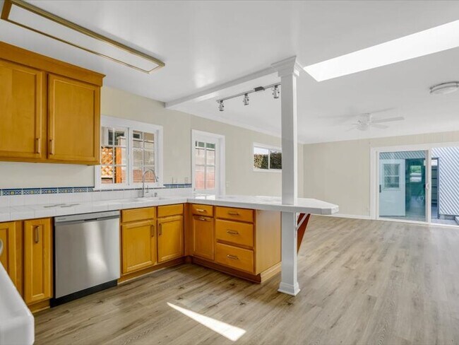 Looking out onto the patio and through to the garage. - 12626 Greene Ave