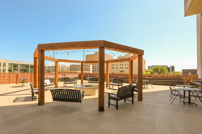 Enjoy some down time on our 4th floor lounge area on the roof of the parking garage. - The Regency