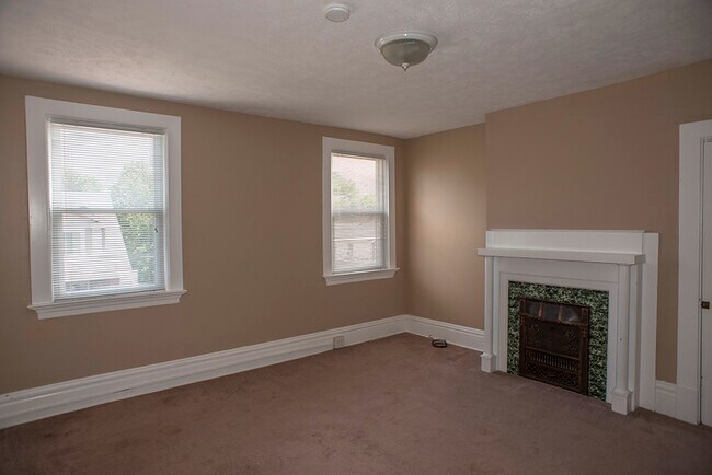 Bedroom with decorative fireplace - 255 Martsolf Ave