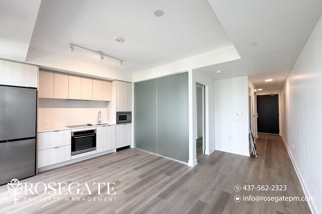 Photo du bâtiment - Brand New 1-Bedroom Condo – 500 Sq Ft in M...