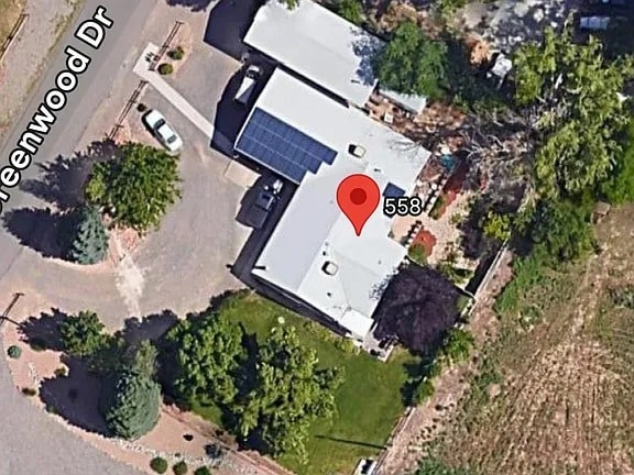 Aerial view of the property. You ca see the large fenced yard and trees that are a part of this ren - 558 W Greenwood Dr