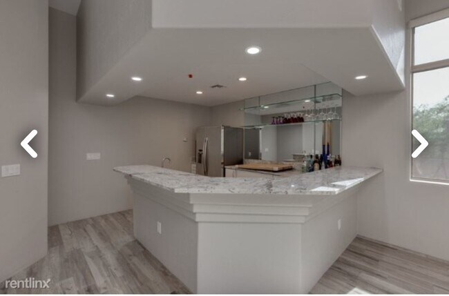 Kitchen with white granite countertops - 15972 N 115th Way