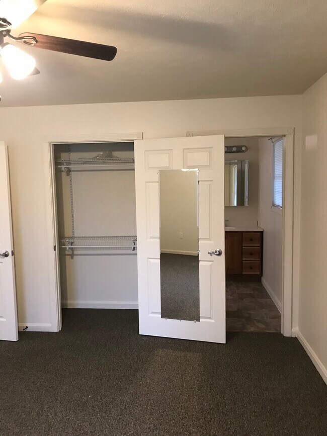 bedroom looking at closet and bath - 18991 Reservoir Rd