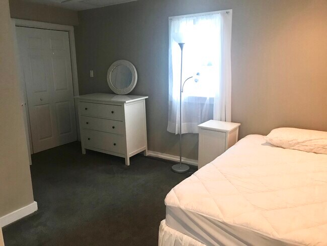Bedroom with washer and dryer - 241 Christian Ave