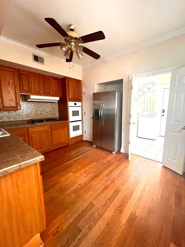 Kitchen (picture is of downstairs unit, but identical layout) - 2900 Palmer Ave