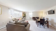 Located at 609 Cedar Avenue in Yeadon, PA, this single-floor residence offers a practical and comfortable layout across a well-utilized footprint. The open living and dining area forms the heart of the home, featuring plush wall-to-wall carpeting, neutral warm-toned walls, and multiple windows that allow generous natural light to fill the space. The living area provides ample room for a full seating arrangement, while the adjacent dining space comfortably accommodates a full dining table and chairs — ideal for everyday meals or entertaining. Baseboard heating is present throughout, and a wall-mounted air conditioning unit ensures year-round comfort. The bedroom is a well-sized, tranquil retreat with carpeted flooring, a large closet with warm-toned wood doors, a window with natural light, and baseboard heating. The full bathroom features wood-look tile flooring, a tiled tub-shower combo, a toilet, and a pedestal-style sink, accented with a light blue tile border that adds a subtle decorative touch. Warm-toned wood doors are a consistent architectural detail throughout the residence, lending a cohesive and classic character to the interior. The overall ambiance is calm, bright, and move-in ready.