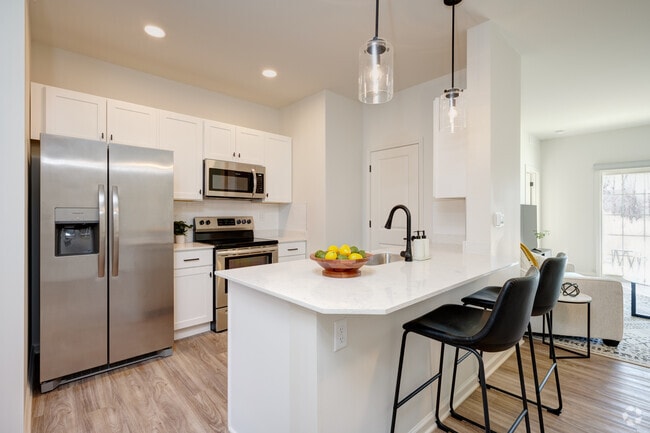 Floor Plan A - 2 BR, 2 BA - 1100 SF. Kitchen and dining room. - Genesee Pointe Apartments