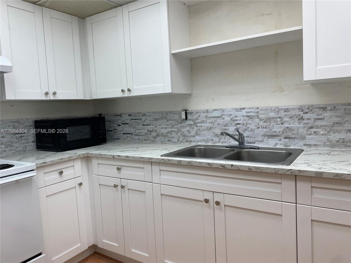 Photo - 10000 Northwest 80th Court, Hialeah Gardens, FL 33016 - 2 BR 2 BA condo