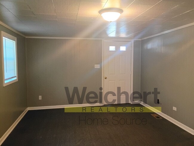 Building Photo - Quality finishes and adaptable design in a desirable location