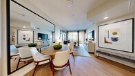 Located on iconic West Sunset Boulevard in Los Angeles, this thoughtfully designed one-bedroom, one-bathroom residence offers a smart, efficient layout across a single floor. The open-concept kitchen and living area forms the heart of the home, where light gray cabinetry, a white tile backsplash, and stainless steel appliances — including a gas range, microwave, and dishwasher — create a clean, contemporary kitchen. Light-toned hardwood flooring flows seamlessly throughout, connecting the kitchen to a dedicated dining area and into the spacious living room. A large floor-to-ceiling mirror amplifies the sense of space in the dining zone, while the living room benefits from a sliding glass door that opens to a private balcony, inviting natural light and outdoor views. The bedroom offers a comfortable retreat with direct access to a dedicated closet featuring built-in shelving and hanging storage. The bathroom is finished with large-format stone tile flooring, wood-look wall tile surround, and a full soaking tub. Recessed lighting throughout, neutral tones, and clean architectural lines contribute to a modern, cohesive ambiance well-suited to urban Los Angeles living.