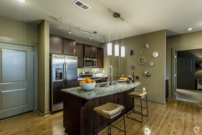 Kitchen islands featuring granite counters - Bowman Pointe