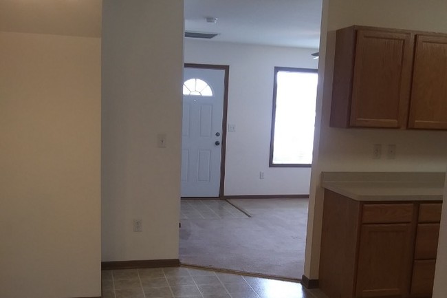 Kitchen looking into Living room - Cobblestone Apartments