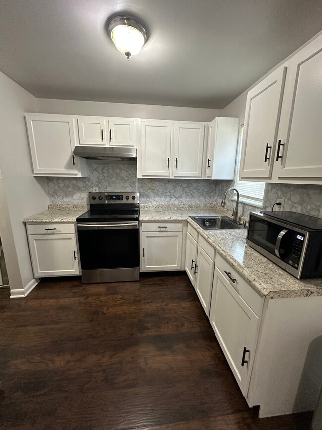 Fairly new appliances - microwave, fridge and stove - 221 Cornett St