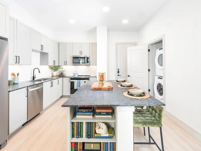 ENERGY STAR® stainless steel appliance package with front control ranges and hidden control dishwashers - Modera McKinney Ridge