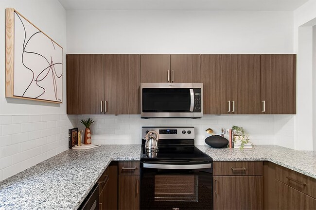 Upgraded kitchen with granite countertops - The Timbers at Issaquah Ridge