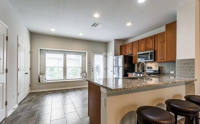 Building Photo - 2-bed 2.5-bath home with detached 2-car garage with EV charger