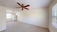 Located at 100 Park Blvd in Cherry Hill, NJ, this two-story home offers 2 bedrooms and 2 bathrooms across two well-proportioned floors. The main level hosts the combined kitchen and living area, where a peninsula counter with dark granite-style countertops separates the kitchen from the carpeted living space. The kitchen is equipped with white cabinetry, a gas range, a stainless steel sink, and a refrigerator, with tile flooring and a window providing natural light. Ceiling fans are featured throughout the home, adding both function and character to each room.

Upstairs, the two bedrooms are carpeted and bright, each with ceiling fans and windows overlooking the surrounding greenery. The primary bedroom offers a generous layout with ample space, while the second bedroom includes direct access to a closet and the hallway. Two dedicated closets provide practical storage across both floors.

The two bathrooms reflect a clean, functional design. One features a tiled soaking tub with a window above, while the other includes a white vanity, a mirrored medicine cabinet with overhead lighting, and a bright window. Neutral tones and light-colored walls throughout the home create a cohesive, airy atmosphere.