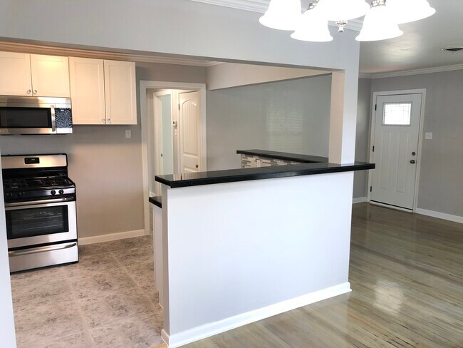 Gorgeous new ceramic kitchen tile, black granite countertops with all new stainless steel appliances! - 914 Campbell St
