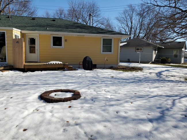 Backyard has deck, patio for your grill, and your own private firepit. - 334 N Belmont Dr