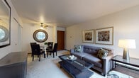 Located at 2220 W Layton Ave in Milwaukee, WI, this single-floor residence offers a well-organized layout designed for comfortable everyday living. The open living and dining area serves as the heart of the home, with soft carpet underfoot and neutral walls that create a warm, inviting atmosphere. Large windows in the living room allow natural light to fill the space, providing pleasant outdoor views of the surrounding greenery. A ceiling fan overhead adds to the comfort of the dining area, which offers ample room for a full dining set. The kitchen features warm oak cabinetry, generous counter space with light-toned laminate surfaces, a stainless steel sink, and easy-to-clean tile flooring — providing a practical and efficient cooking space. Both bedrooms are carpeted and tranquil, each with windows that bring in natural light and closet storage. The bathroom is tiled in classic cream tones, complete with a pedestal sink, medicine cabinet mirror, and a tub-shower combination. Throughout the residence, wood-toned doors and trim add a cohesive, understated character. The overall ambiance is clean, functional, and move-in ready, making it a practical home in a convenient Milwaukee location.