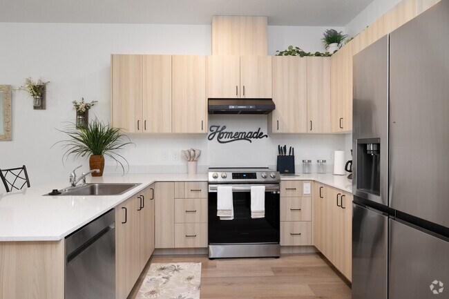 2 habitaciones, 1.5 baños - 1,060 pies cuadrados - Cocina - Autumn Leaf Apartments 55+ Community