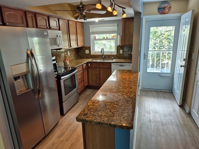 Building Photo - Waterfront Community Living | Updated 2BR/2BA Condo with Private Beach Access