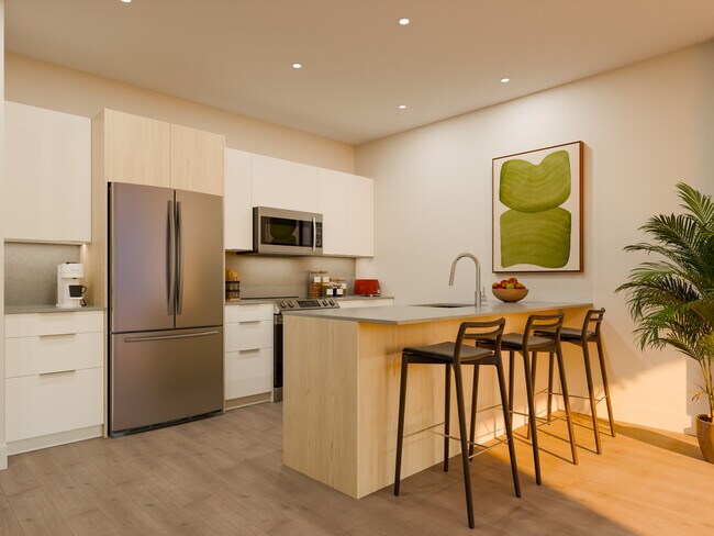 Photo du bâtiment - 2 Bedroom + Den Apartment