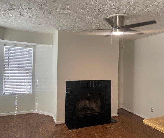 Open concept living room with fireplace - 4441 Old College Rd