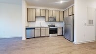 This 610 square foot apartment in Kissimmee, Florida offers a well-designed living space with one bedroom and one bathroom. The primary bedroom, measuring 130 square feet, provides ample space and features large windows that allow natural light to flood the room. The apartment boasts a modern kitchen equipped with stainless steel appliances, light wood cabinetry, and a subway tile backsplash, creating a sleek and functional cooking area. The bathroom is fitted with a granite countertop vanity and a shower-tub combination. Throughout the apartment, you'll find neutral-toned carpeting in the bedroom and wood-look flooring in the main living areas, adding warmth and durability. A dedicated laundry area with full-sized washer and dryer units offers convenience. The apartment also includes a closet for additional storage. With its efficient layout and contemporary finishes, this apartment presents a comfortable and stylish living option in a desirable Kissimmee location.