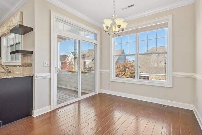 Building Photo - Introducing a stunning three-story townhom...