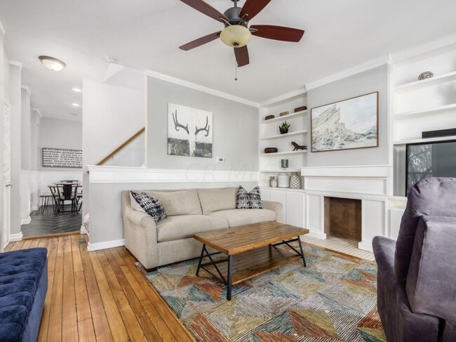 Living Room with Built-In Bookcases and Hardwood Floors - 383 Hanford St