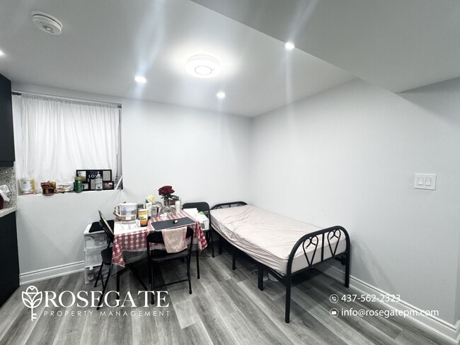 Photo du bâtiment - Bright 1 Bedroom + Den (Usable as 2nd Bedroom) Basement Apartment with Parking