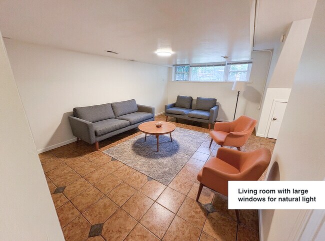 Large living room with 7.5 ft ceilings and lots of natural light - 2820 N Hamlin Ave