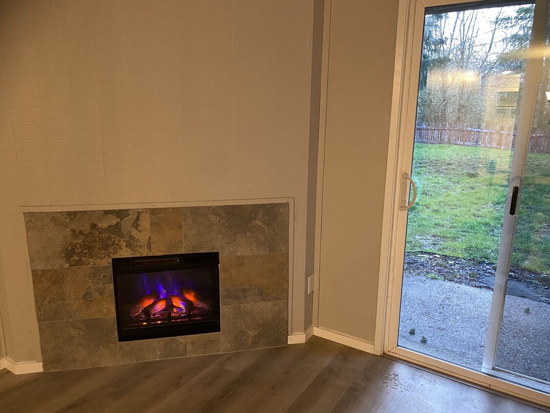 Electric Fireplace in living room - 19871 NW Rock Creek Blvd