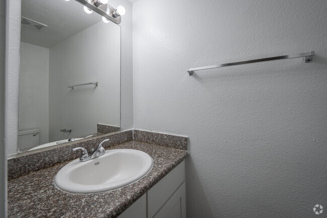 1BR, 1.5BA - 820SF - Half Bath - Springwood Park Apartments