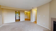 Located at 2540 Sunset Dr in Longmont, Colorado, this single-floor residence offers a well-organized layout designed for comfortable everyday living. The spacious living room is a central highlight, featuring plush wall-to-wall carpeting, warm neutral-toned walls, and a fireplace framed by a sliding glass door that opens to a private balcony with open views of the surrounding area. Natural light flows generously throughout the space.

The galley-style kitchen is efficiently designed with light wood cabinetry lining both sides, ample counter space, a double-basin sink, and black appliances including a range, refrigerator, and built-in microwave. Hardwood-style flooring runs the length of the kitchen, adding warmth and easy maintenance.

The bedrooms are well-proportioned, each finished with soft carpeting, textured ceilings, and large windows that bring in natural light and neighborhood views. The rooms feature clean white trim and doors, maintaining a consistent, cohesive aesthetic throughout.

The bathroom includes a full tub-shower combination with tiled surround, a vanity with under-cabinet storage, and hardwood-style flooring. Warm yellow accent walls give the bathroom a distinct, inviting character. Throughout the home, the neutral palette, textured ceilings, and consistent finishes create a calm and practical living environment.