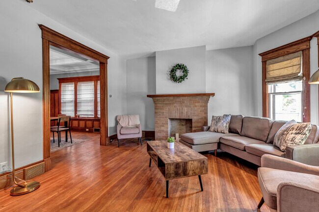 Living room with ample seating and a 55in TV. - 45 Saint James Pl