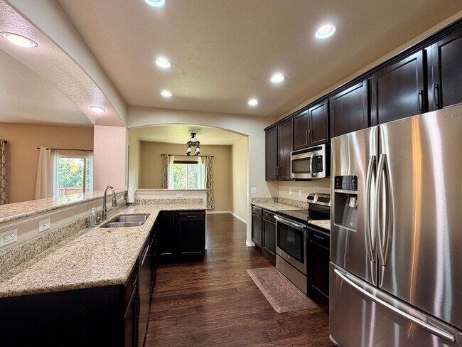 Building Photo - GRAND Liberty Ranch Home | 5 Bedrooms | Finished Basement + Bar | 3-Car Tandem Heated Garage | Pr...