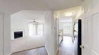 Located at 2207 Wickersham Lane in Austin, TX, this single-story 2-bedroom, 2-bathroom home offers a well-designed layout that balances comfort and functionality. The open-concept living room is bright and welcoming, featuring plush carpeting, a ceiling fan, and a classic tiled fireplace that serves as a natural focal point. Natural light filters in through windows overlooking the outdoor deck, enhancing the airy ambiance of the space. The kitchen is thoughtfully appointed with white cabinetry, gray tile backsplash, wood-look flooring, stainless steel appliances, and a peninsula with a light stone countertop — connecting seamlessly to the living area. The spacious primary bedroom includes carpet flooring, a ceiling fan, a window with outdoor views, and direct access to a dedicated bathroom and a walk-in closet outfitted with wire shelving. The second bedroom similarly features carpet flooring and a ceiling fan. Both bathrooms are clean and functional, each with a tub-shower combination and neutral finishes. A dedicated closet provides additional storage. The outdoor deck, visible from the living area, adds an inviting extension of the living space, ideal for relaxing or entertaining.