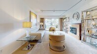 Located at 1612 Denise Dr in Forest Hill, Maryland, this single-floor home offers a thoughtfully designed layout that blends contemporary and traditional elements throughout. The living room is a standout space, featuring track lighting, neutral tones, plush carpeting, and a sliding glass door that opens to an outdoor area, filling the room with natural light and garden views. A sleek, modern aesthetic is carried through with contemporary furnishings and curated artwork. The dining room impresses with large-format tile flooring, a dramatic sculptural chandelier, a round glass-top table with chrome-accented chairs, and generous natural light from surrounding windows. The kitchen is well-appointed with white cabinetry, hardwood floors, ample counter space, and a bright window overlooking the outdoors. Two bedrooms provide comfortable retreats; one features warm wood furniture and carpeted floors, while another offers a classic iron bed frame, louvered closet doors, and floral accents. A dedicated office space includes built-in cabinetry, tile flooring, and a streamlined work surface ideal for productivity. The bathroom is clean and bright, finished with white tile flooring, a vanity with modern hardware, and a natural light-filled window. Overall, the home balances functionality with inviting, well-curated design.