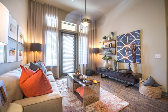 Living room with hard surface flooring and ceiling fan - Avalon Lakeside