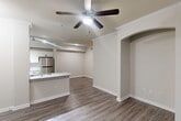 This 730 square foot single-story home in Richmond, TX offers a compact yet functional living space. The property features two bedrooms, including a spacious 150 square foot primary bedroom, and one bathroom. The interior showcases a modern aesthetic with neutral tones throughout.

The bedrooms are equipped with plush carpeting, ceiling fans, and large windows fitted with horizontal blinds, allowing for ample natural light and privacy control. The bathroom boasts a contemporary design with a tiled shower/tub combination and updated fixtures.

The kitchen is a highlight, featuring sleek white cabinetry, granite countertops, and stainless steel appliances. The open layout seamlessly connects to other living areas, enhanced by durable wood-look flooring that extends throughout the main living spaces.

Storage is optimized with two closets, ensuring ample space for personal belongings. The home's efficient design makes use of every square foot, creating a cozy yet uncluttered atmosphere. Crown molding adds a touch of elegance to the rooms, while recessed lighting provides even illumination throughout the space.

Located at 21811 Wildwood Park Road, this property offers a blend of modern comfort and practical living in a desirable Richmond neighborhood.