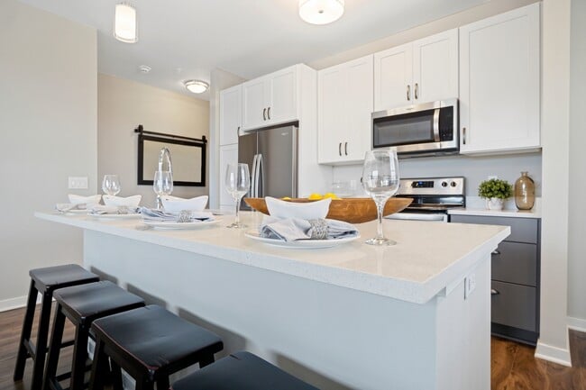 Seasons at River View Apartments in Pleasant Prairie, Wisconsin. Luxury, condo style, studio, 1 bedroom, 2 bedroom, and 3 bedroom apartments, with private garages and entries. - Seasons at River View