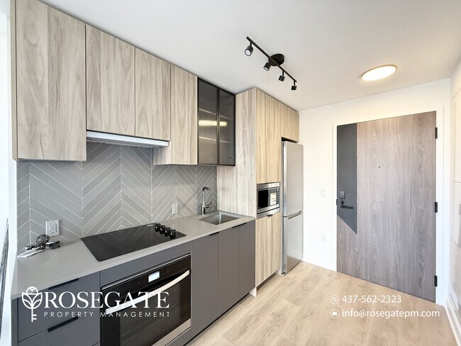 Photo du bâtiment - Modern 1-Bedroom Condo with Private Balcon...