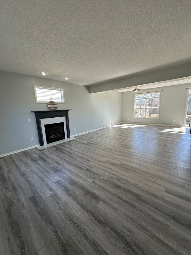 Entrance + Fire Place Sitting Room - 411 Treeline Cv