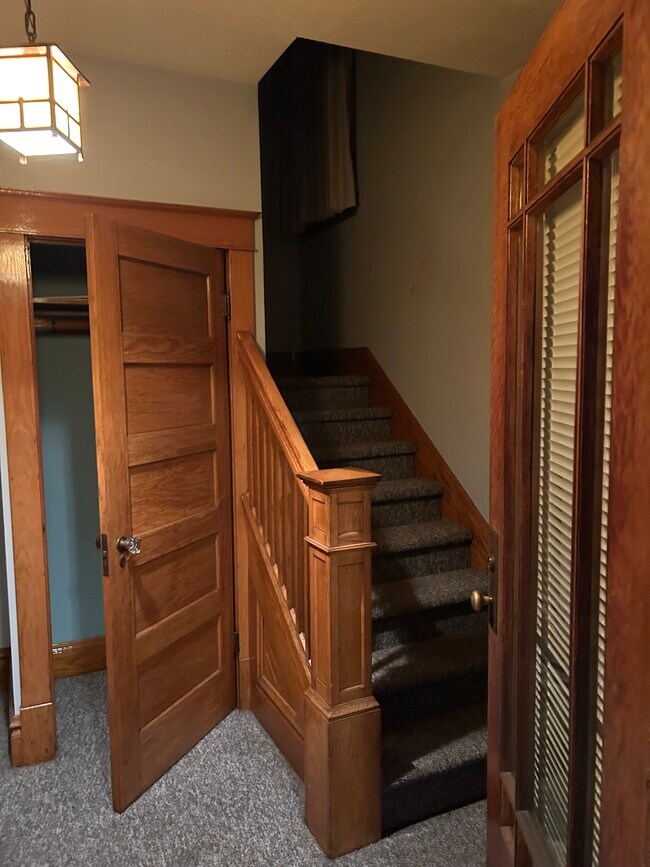 Classic craftsman entry with original hardwood moldings and trim. - 514 Electric Ave