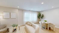 Located in Toms River, NJ, this thoughtfully designed 2-bedroom, 2-bathroom residence offers a clean, modern aesthetic across a single-floor layout. The open-concept living room is bathed in natural light from large windows dressed with sheer curtains, complemented by light hardwood flooring, recessed lighting, and a neutral palette that creates a calm, airy atmosphere throughout.

The kitchen is a standout feature, boasting flat-front light wood cabinetry, a generous white quartz waterfall island with seating, stainless steel appliances including a gas range, microwave, and French door refrigerator, plus stylish globe pendant lighting. An in-unit stacked washer and dryer adds everyday convenience.

The spacious primary bedroom carries the same serene aesthetic, with light hardwood floors, sheer-draped windows, and ample room for a seating area. Its en-suite bathroom features a walk-in glass-enclosed shower with elegant marble-look tile surround and built-in niche. The second bedroom is bright and versatile, with natural light and a cozy, welcoming feel. The second bathroom offers a full soaking tub with tiled surround and niche shelving. A dedicated closet and hallway complete the well-organized floor plan.