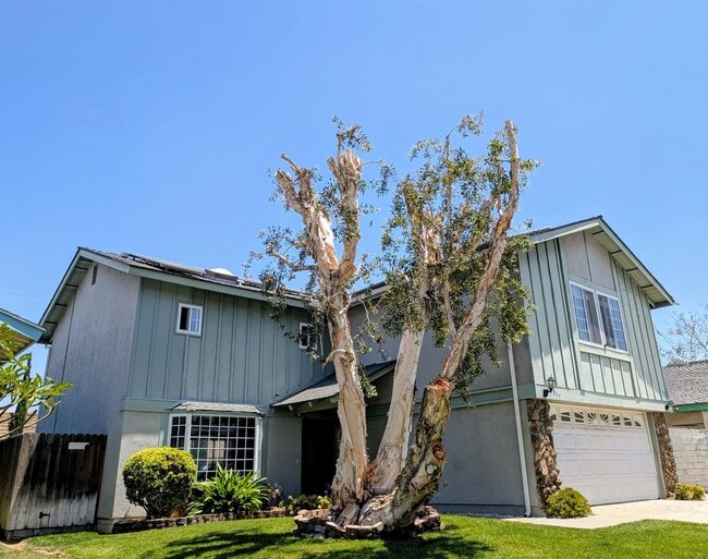 Building Photo - 2 stories - 4 Bedrooms + 2.5 Baths.  Swimming Pool + Solar Panels !!